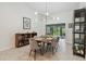 Well-lit dining room with contemporary light fixture, stylish furniture, and neutral decor at 48 Bishop Creek Dr, Safety Harbor, FL 34695