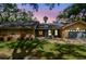 Charming single-Gathering home with a well-maintained lawn and a two-car garage at 48 Bishop Creek Dr, Safety Harbor, FL 34695