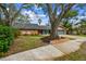Charming single-Gathering home with a well-maintained lawn and a two-car garage at 48 Bishop Creek Dr, Safety Harbor, FL 34695