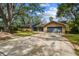 Charming single-Gathering home with a well-maintained lawn and a two-car garage at 48 Bishop Creek Dr, Safety Harbor, FL 34695