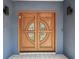 Close-up of the beautiful double front doors with leaded glass and sidelights at 48 Bishop Creek Dr, Safety Harbor, FL 34695