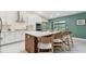 Gourmet kitchen features stainless appliances, custom cabinets and a large center island at 48 Bishop Creek Dr, Safety Harbor, FL 34695