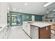 Modern kitchen with stainless steel appliances and an island perfect for cooking and entertaining at 48 Bishop Creek Dr, Safety Harbor, FL 34695