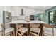 Gourmet kitchen featuring stainless appliances, custom cabinets and a large center island with seating at 48 Bishop Creek Dr, Safety Harbor, FL 34695