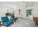 The open-concept living room seamlessly connects to the dining area and features abundant natural light at 48 Bishop Creek Dr, Safety Harbor, FL 34695