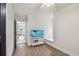 Cozy living room area featuring built in TV and lots of natural light at 48 Bishop Creek Dr, Safety Harbor, FL 34695
