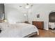 Bright main bedroom featuring a ceiling fan and a modern dresser at 48 Bishop Creek Dr, Safety Harbor, FL 34695
