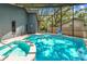 Beautiful backyard pool with an attached spa and ample brick patio space at 48 Bishop Creek Dr, Safety Harbor, FL 34695