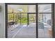Enjoy outdoor living on this screened porch with skylights and views of the lush backyard at 48 Bishop Creek Dr, Safety Harbor, FL 34695