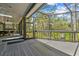 Large screened porch featuring a seamless transition to a landscaped backyard and outdoor entertaining spaces at 48 Bishop Creek Dr, Safety Harbor, FL 34695