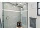 Contemporary shower boasting dual shower heads, stylish tiling, and a clear glass enclosure at 48 Bishop Creek Dr, Safety Harbor, FL 34695