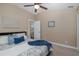 Comfortable bedroom with light walls, ceiling fan, and natural light at 502 Creekside Ct, Safety Harbor, FL 34695