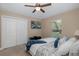 Cozy bedroom with TV, large closet, and window with natural light at 502 Creekside Ct, Safety Harbor, FL 34695