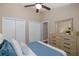 Spacious bedroom featuring vaulted ceilings, double closets, and a light wood dresser at 502 Creekside Ct, Safety Harbor, FL 34695