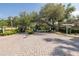 Gated community entrance with mature trees, brick paved street, and manicured landscaping at 502 Creekside Ct, Safety Harbor, FL 34695