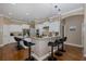 Open kitchen with island seating, stainless steel appliances, and modern pendant lighting at 502 Creekside Ct, Safety Harbor, FL 34695