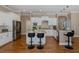Kitchen with island seating, stainless steel appliances, granite countertops, and modern pendant lighting at 502 Creekside Ct, Safety Harbor, FL 34695