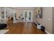 Spacious living area with wood floors, bar seating, and access to the pool at 502 Creekside Ct, Safety Harbor, FL 34695