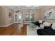 Bright living room with wood floors, modern lighting, and contemporary decor at 502 Creekside Ct, Safety Harbor, FL 34695