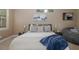 Comfortable main bedroom featuring a king bed, accent pillows, and a cozy beanbag chair at 502 Creekside Ct, Safety Harbor, FL 34695
