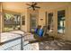 Covered patio with chaise lounges, offering a relaxing space with a view of the pool and backyard at 502 Creekside Ct, Safety Harbor, FL 34695