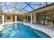 Screened-in pool and patio with seating area, offering a luxurious outdoor living space at 502 Creekside Ct, Safety Harbor, FL 34695