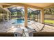 Screened-in pool with patio and lounge chairs, providing a private and relaxing outdoor oasis at 502 Creekside Ct, Safety Harbor, FL 34695