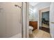 Bright bathroom features ceramic tiles, glass shower and a wood vanity with extra storage space at 5109 Hartwell Loop, Land O Lakes, FL 34638