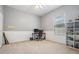Bedroom with neutral walls, a window with blinds, and shelves for storage and decor at 5109 Hartwell Loop, Land O Lakes, FL 34638