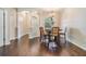 Elegant dining room with hardwood floors, arched window, and chandelier at 5109 Hartwell Loop, Land O Lakes, FL 34638