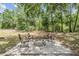 Stone fire pit and chairs for relaxing outdoors with Gathering and friends in paver-covered area at 5109 Hartwell Loop, Land O Lakes, FL 34638