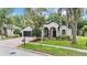 Lovely single-story home with a manicured lawn, brick driveway, and an arched front porch at 5109 Hartwell Loop, Land O Lakes, FL 34638