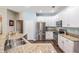 Modern kitchen features granite countertops, stainless steel appliances, and bright white cabinets at 5109 Hartwell Loop, Land O Lakes, FL 34638