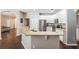 Bright kitchen with stainless steel appliances and a granite breakfast bar with ample seating at 5109 Hartwell Loop, Land O Lakes, FL 34638