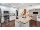 Well-equipped kitchen with granite countertops, stainless appliances, and peninsula island at 5109 Hartwell Loop, Land O Lakes, FL 34638