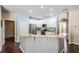 Open kitchen with granite countertops, white cabinets, and stainless steel appliances at 5109 Hartwell Loop, Land O Lakes, FL 34638