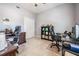 Bright office space features neutral paint, a ceiling fan, and closet for storage and organization at 5109 Hartwell Loop, Land O Lakes, FL 34638