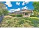 Expansive backyard featuring a screened enclosure, lush green landscaping, and a sturdy iron fence at 5117 Longspur Ct, Lithia, FL 33547