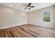 Bedroom featuring hardwood floors, ceiling fan and one window at 5117 Longspur Ct, Lithia, FL 33547