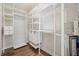 Spacious walk-in closet featuring custom shelving and drawers, providing ample storage solutions at 5117 Longspur Ct, Lithia, FL 33547