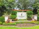 Community sign for Fish Hawk Ranch by Newland Communities, with colorful plants and greenery at 5117 Longspur Ct, Lithia, FL 33547