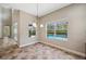 Bright dining area with multiple windows offering views of the screened pool and lush greenery at 5117 Longspur Ct, Lithia, FL 33547
