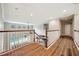 Hallway featuring wood floors and a view of the pool at 5117 Longspur Ct, Lithia, FL 33547