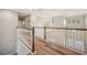 Hallway featuring wood floors and chandelier at 5117 Longspur Ct, Lithia, FL 33547