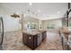 Gourmet kitchen with stainless steel appliances, granite countertops and a kitchen island at 5117 Longspur Ct, Lithia, FL 33547