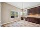 Bright breakfast nook featuring a window with a view of the backyard and access to built-in cabinetry at 5117 Longspur Ct, Lithia, FL 33547