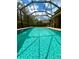 A refreshing screened-in pool with clear, sparkling blue water at 5117 Longspur Ct, Lithia, FL 33547