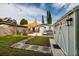 Expansive backyard with a dining area, outdoor grill, shed, and stepping stones, perfect for entertaining and relaxing at 5527 Kelly N Dr, St Petersburg, FL 33703