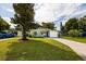 Charming single-story home featuring well-kept lawn, driveway, and attached garage at 5527 Kelly N Dr, St Petersburg, FL 33703
