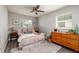 Cozy primary bedroom with soft decor, wooden accents, and ample natural light at 5527 Kelly N Dr, St Petersburg, FL 33703